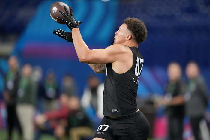 Mar 1, 2024; Indianapolis, IN, USA; Penn State tight end Theo Johnson (TE07) works out during the 2024 NFL Combine at Lucas Oil Stadium.